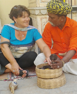 Travel Astu guest Bruny with snake charmer during India tour