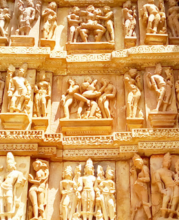 Erotic sex poses at wall of Khajuraho temple